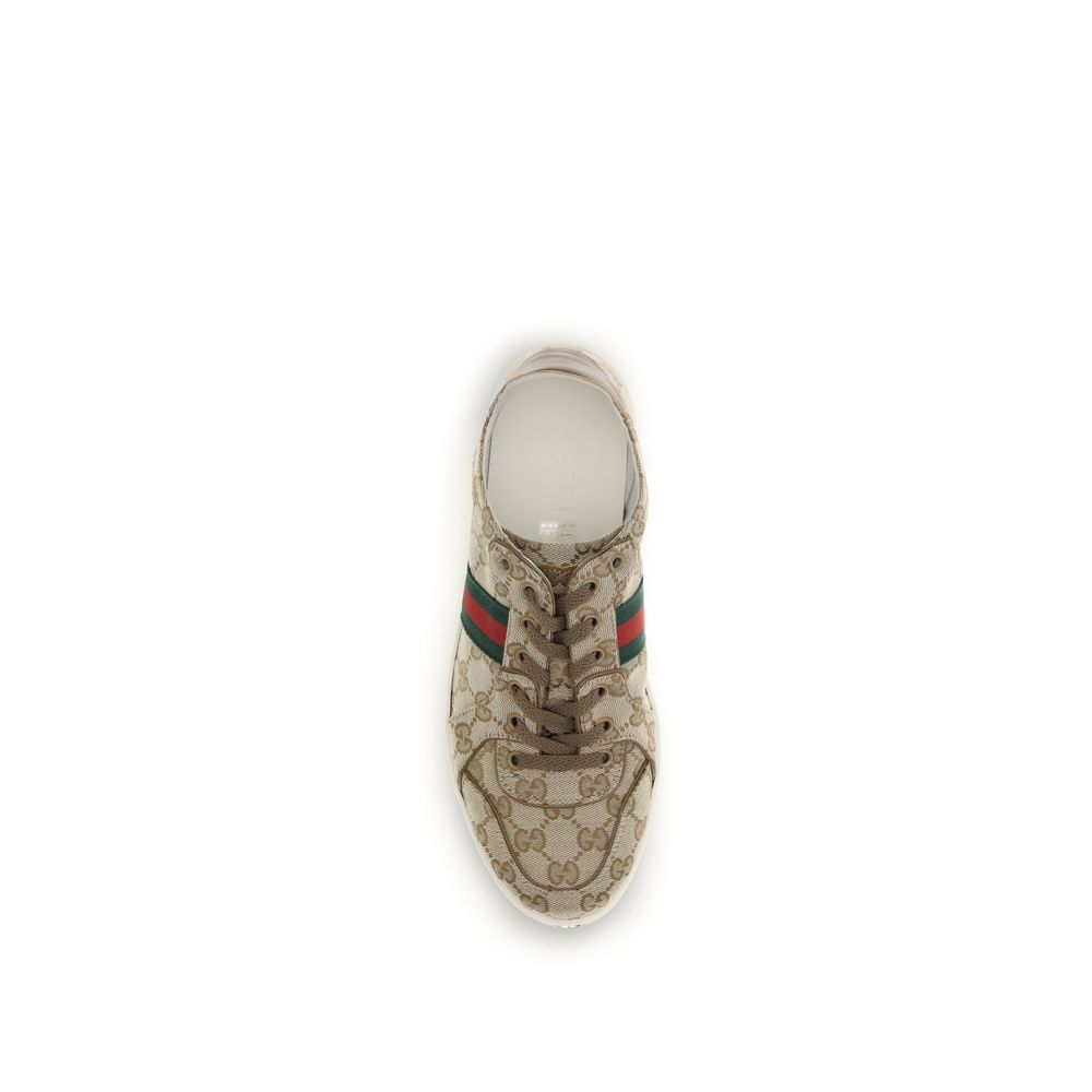 Athletic Sneakers by Gucci for men in rubber & fabric beige, signature & striped showcases a architectural silhouette, artfully capturing the essence of the Gg Men's Athletic Rubber & Fabric Sneakers with its signature architectural athletic style construction.