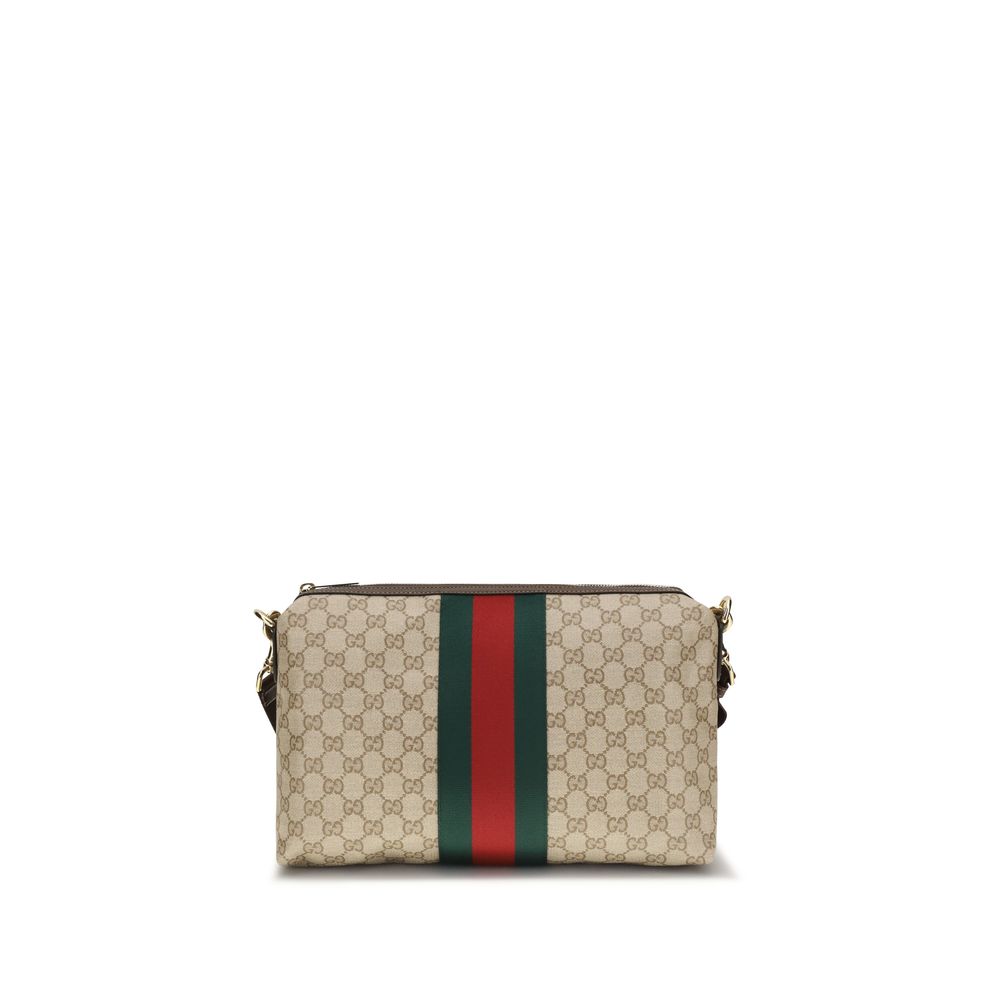 Medium Shoulder Bag by Gucci for men in nylon faux leather & canvas beige, gold, green, red, signature, print & striped features a enviable silhouette, showcasing a secure zipper, ample , and enviable shoulder-strap, wristlet, adjustable-strap & detachable-strap for a enviable finish.