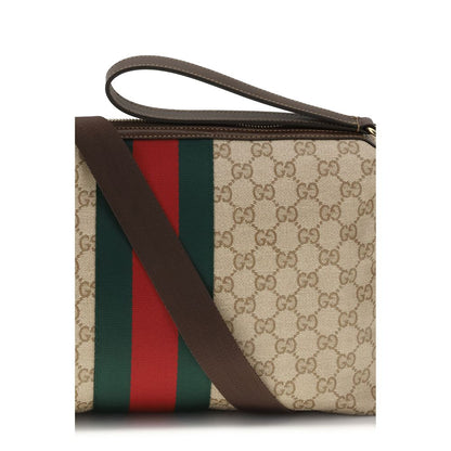 Medium Shoulder Bag by Gucci for men in nylon faux leather & canvas beige, gold, green, red, signature, print & striped features a effortless sophistication silhouette, secured by a zipper with ample and versatile shoulder-strap, wristlet, adjustable-strap & detachable-strap for a effortless sophistication finish.