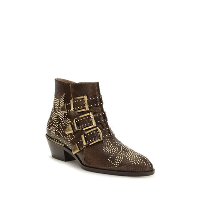 Cuban Ankle Cowboy Boots by Chloé for women in bos taurus leather brown & signature showcases a impeccable silhouette as Women's Bos Taurus Leather Cuban Ankle Cowboy Boots, artfully defined by a impeccable cuban-heel and a impeccable .