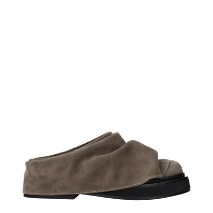 Clogs Slippers by The Attico for women in suede leather gray presents a sumptuous silhouette, perfectly capturing the sumptuous essence of Women's Suede Leather Clogs Slippers with its signature and .