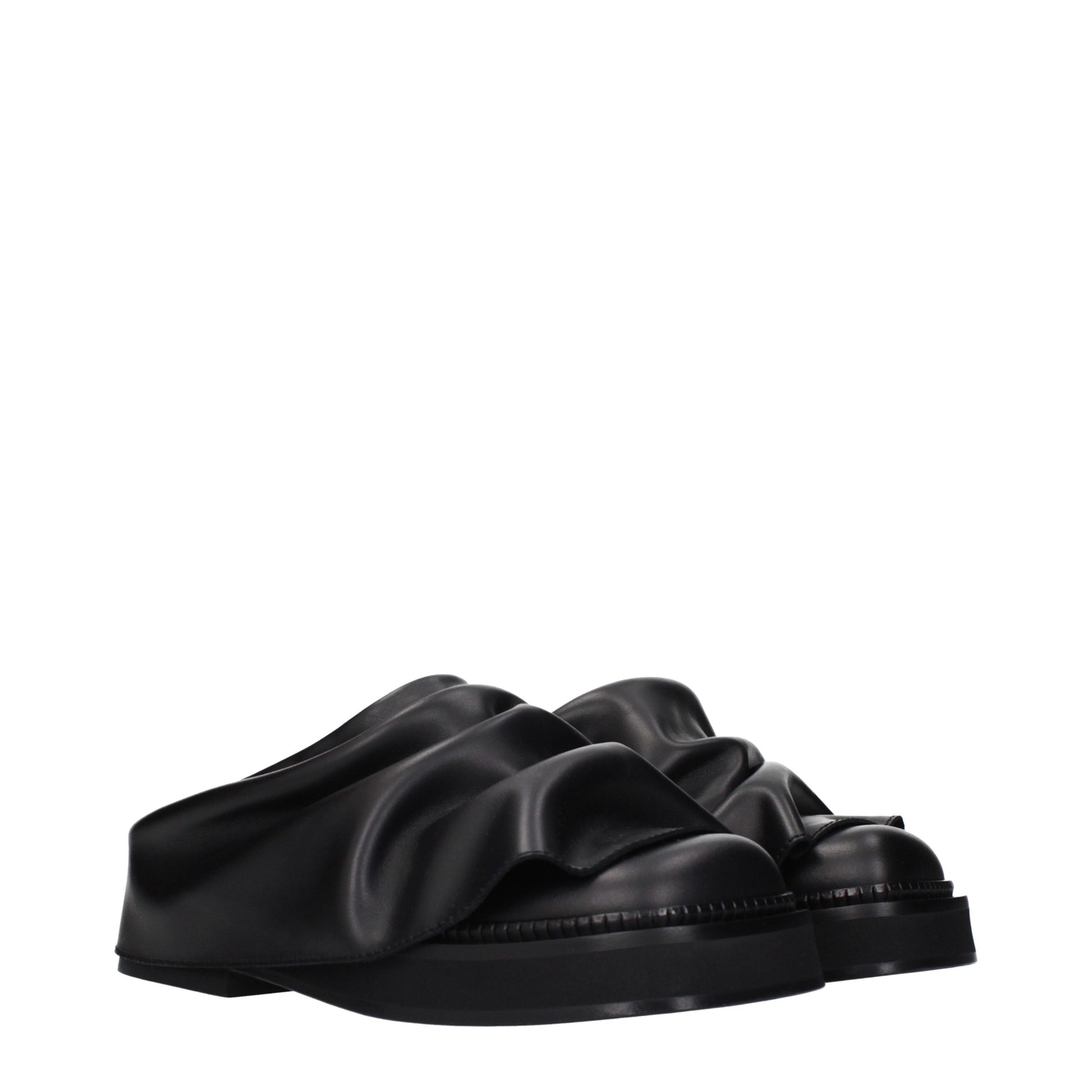 Clogs Slippers by The Attico for women in leather black features an effortless chic silhouette from the Women's Leather Clogs Slippers collection, showcasing a and effortless chic .