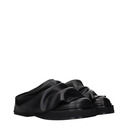 Clogs Slippers by The Attico for women in leather black features an effortless chic silhouette from the Women's Leather Clogs Slippers collection, showcasing a and effortless chic .