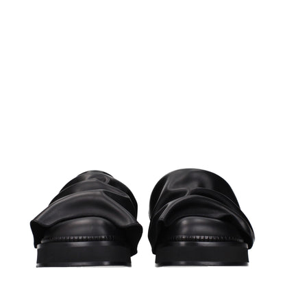 Clogs Slippers by The Attico for women in leather black features an effortlessly elegant silhouette, showcasing the Women's Leather Clogs Slippers design with an effortlessly elegant and a for a effortlessly elegant look.