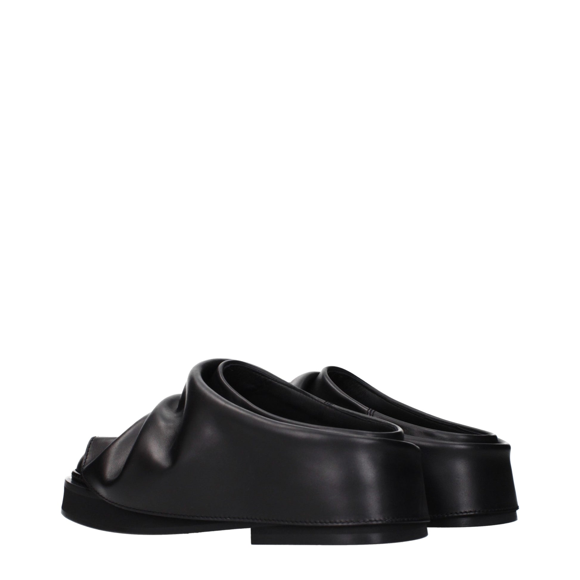Clogs Slippers by The Attico for women in leather and black presents a sculptural silhouette as Women's Leather Clogs Slippers, featuring a sculptural and a sculptural for refined comfort.