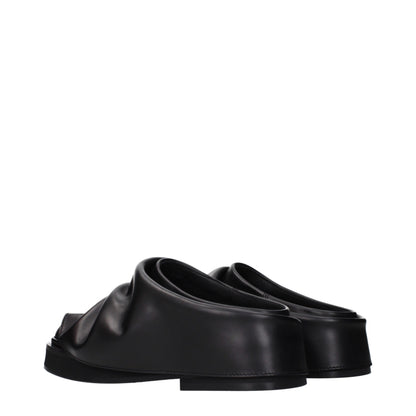 Clogs Slippers by The Attico for women in leather and black presents a sculptural silhouette as Women's Leather Clogs Slippers, featuring a sculptural and a sculptural for refined comfort.