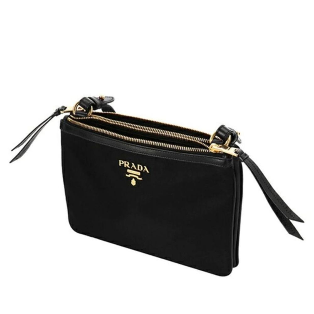 Crossbody Handbag by Prada for women in nylon black & gold features a transformative elegance silhouette, showcasing a secure zipper, organized , and versatile crossbody-strap, shoulder-strap & detachable-strap for a transformative elegance look.