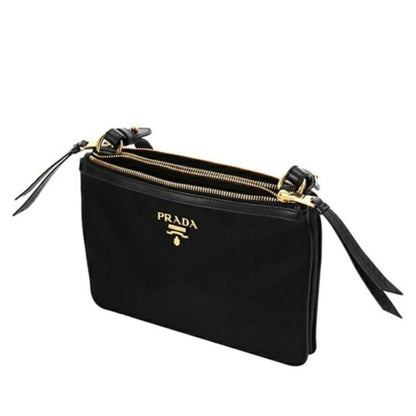 Crossbody Handbag by Prada for women in nylon black & gold features a transformative elegance silhouette, showcasing a secure zipper, organized , and versatile crossbody-strap, shoulder-strap & detachable-strap for a transformative elegance look.