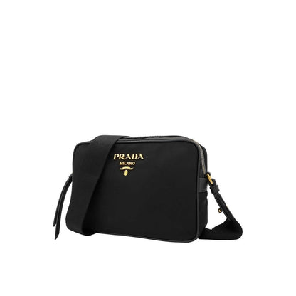 Shoulder Bag by Prada for women in nylon & leather black features a effortless sophistication silhouette, secured by a zipper with ample and versatile shoulder-strap & detachable-strap for a effortless sophistication finish.
