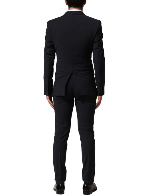 Pant Suit by Dolce & Gabbana for men in polyester & wool black showcases a sartorial silhouette, artfully detailed with a sophisticated single-breasted neckline and a sartorial slim for a refined, high-fashion aesthetic.