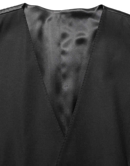 Pant Suit by Dolce & Gabbana for men in virgin wool & silk black showcases an bespeak silhouette, artfully detailed with a sophisticated wrap single-breasted neckline and an bespeak slim for a refined finish.