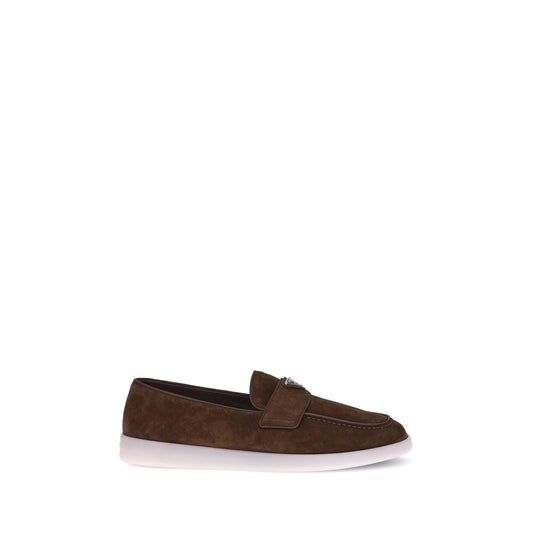 Flat Loafer Slip-On Shoes by Prada for men in bos taurus calf suede leather brown features an ergonomic silhouette, perfectly showcasing Men's Bos Taurus Calf Suede Leather Flat Loafer Slip-On Shoes with its distinct flat and elegant almond toe style.