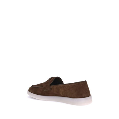 Flat Loafer Slip-On Shoes by Prada for men in bos taurus calf suede leather brown showcases a resplendent Men's Bos Taurus Calf Suede Leather Flat Loafer Slip-On Shoes aesthetic, defined by its resplendent almond toe style and elegant flat.