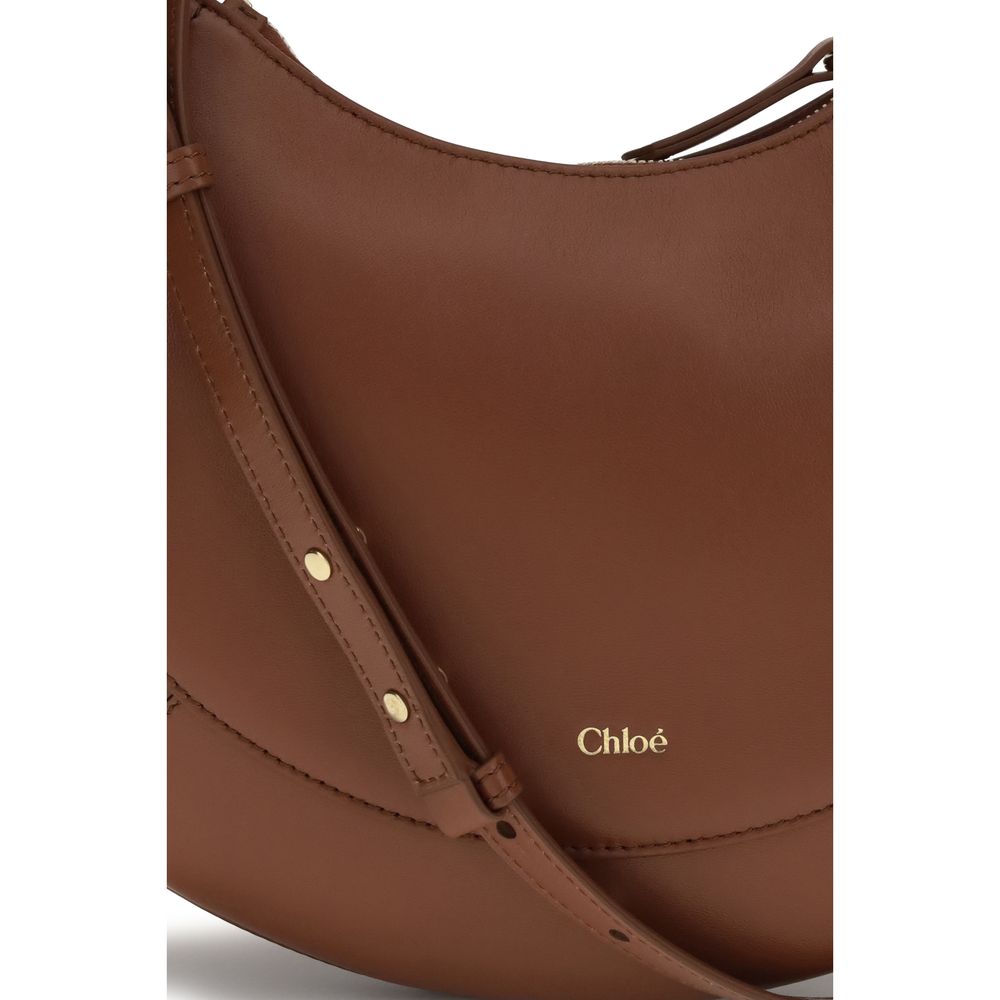 Shoulder Bag by Chloé for women in bio-acetate cotton & bos taurus calf leather brown showcases a enviable silhouette, artfully detailed with a secure buckle, organized external-pockets & cardholder, and versatile shoulder-strap & adjustable-strap for a enviable look.