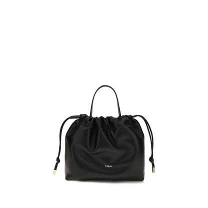Mini Crossbody Drawstring Shoulder Bag by Chloé for women in nappa lambskin leather black features a enviable silhouette, showcasing a secure drawstring, ample , and enviable crossbody-strap, shoulder-strap & handle for a enviable finish.