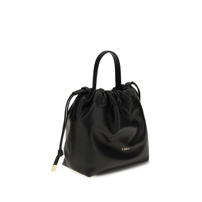 Mini Crossbody Drawstring Shoulder Bag by Chloé for women in nappa lambskin leather black showcases a enviable silhouette, artfully detailed with a secure drawstring, organized , and versatile crossbody-strap, shoulder-strap & handle for a enviable look.