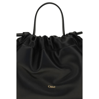 Mini Crossbody Drawstring Shoulder Bag by Chloé for women in nappa lambskin leather black features a effortless sophistication silhouette, secured by a drawstring with ample and versatile crossbody-strap, shoulder-strap & handle for a effortless sophistication finish.