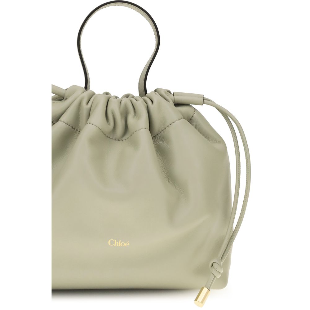 Shoulder Drawstring Bag by Chloé for women in nappa lambskin leather gray features an effortlessly chic silhouette with a secure drawstring, ample , and versatile shoulder-strap & handle for effortlessly chic everyday luxury.