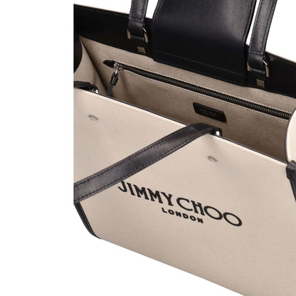 This Tote Bag by Jimmy Choo for women in canvas beige features an jet-set Canvas Tote Bag design with a secure zipper, magnetic & button, ample , and jet-set handle.
