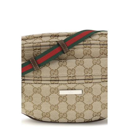 Small Shoulder Bag by Gucci for men in cotton polyester canvas beige, green, red, silver, signature & striped features a distinguished silhouette, showcasing a secure zipper and distinguished with versatile shoulder-strap & adjustable-strap for a distinguished finish.