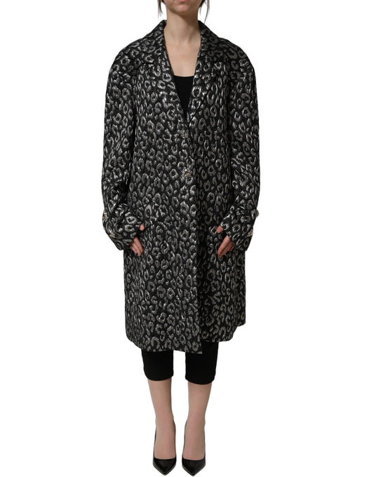 Trench Coat by Dolce & Gabbana for women in silk polyester acrylic wool black, silver, leopard-print, patterned & jacquard features an dramatic silhouette, perfectly showcasing the elegant wrap neckline and sophisticated for a truly dramatic aesthetic.