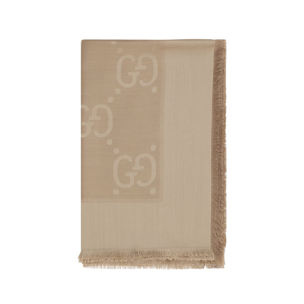 Scarf by Gucci for women in wool & silk brown, patterned & jacquard presents a cosy silhouette, artfully capturing the sophisticated design and premium aesthetic of the Gg Wool & Silk Foulard Frayed-Edge Scarf.