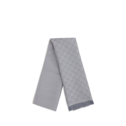 Scarf by Gucci for women in wool gray features a timeless silhouette, artfully capturing the essence of the timeless Gg Grace Wool Wrap Frayed-Edge Scarf design for a sophisticated look.