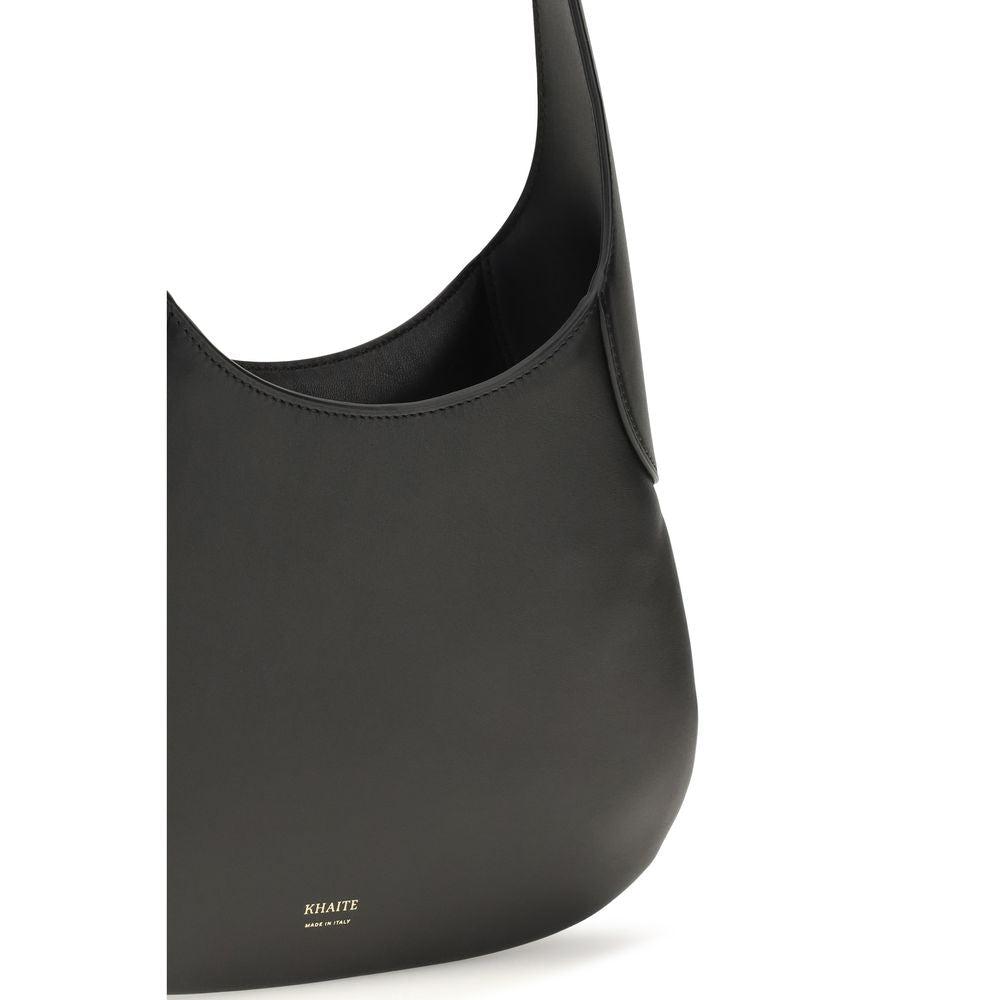 Small Shoulder Hobo Handbag by Khaite for women in bos taurus calfskin leather black & gold features a signature silhouette, showcasing a secure and signature with versatile shoulder-strap for a sophisticated look.