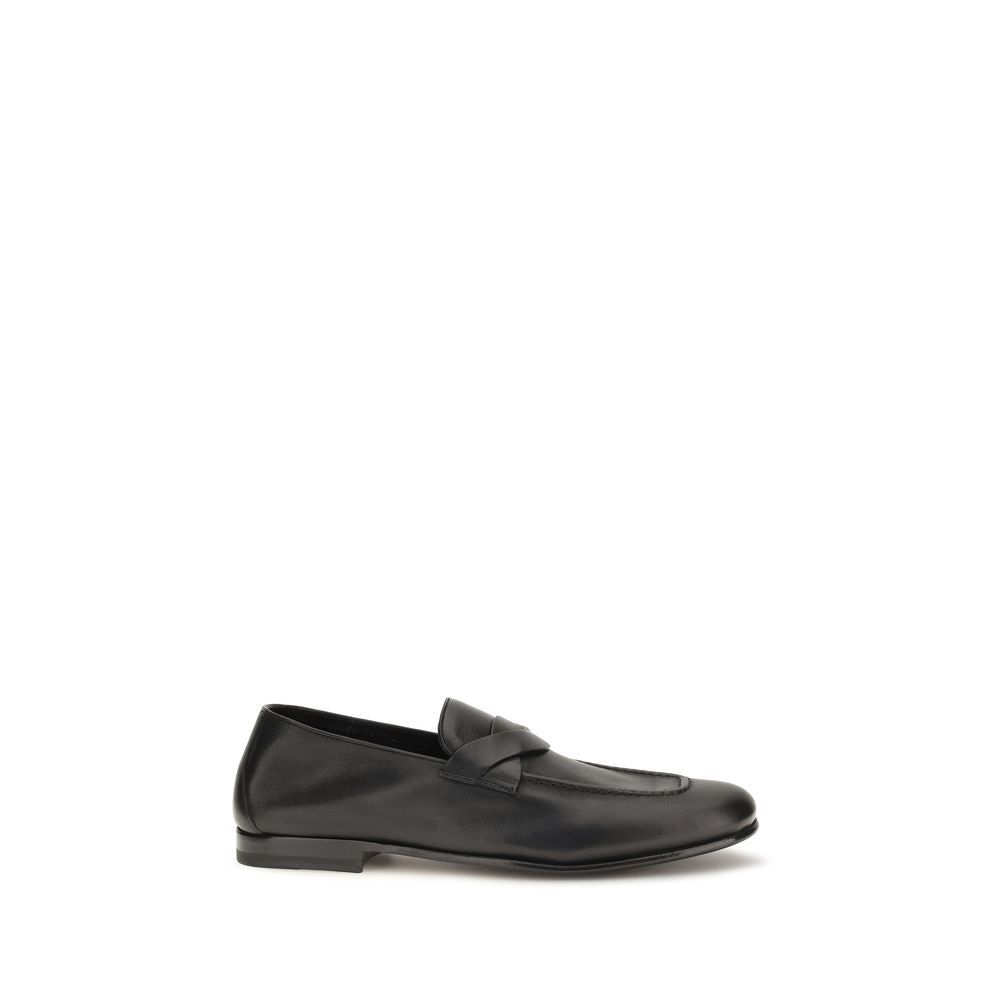Loafer Slip-On Strap Shoes by Tom Ford for men in bos taurus calf leather black showcases a timeless silhouette from the Gigi Men's Bos Taurus Calf Leather Loafer Slip-On Strap Shoes collection, featuring a timeless and for a timeless finish.