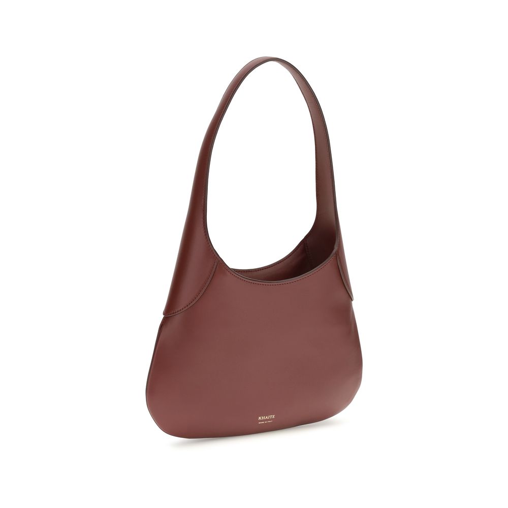 Small Shoulder Hobo Handbag by Khaite for women in bos taurus calfskin leather bordeaux & gold features a refined silhouette, showcasing a secure , organized , and versatile shoulder-strap for a refined finish.