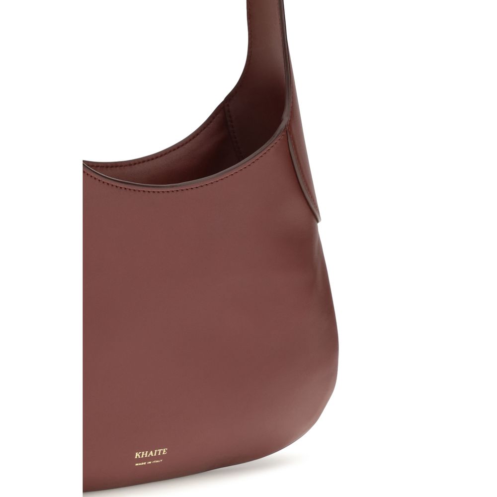 Small Shoulder Hobo Handbag by Khaite for women in bos taurus calfskin leather bordeaux & gold features a exquisite silhouette, showcasing a secure and exquisite with versatile shoulder-strap for a exquisite finish.