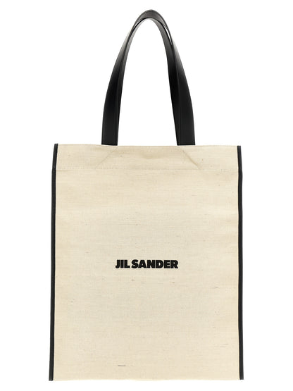 Medium Shopper Tote Bag by Jil Sander for women in cotton polyester & horn bicolour, black, white & print features an jet-setting Cotton Polyester & Horn Medium Shopper Tote Bag design with a secure , jet-setting , and versatile handle for a jet-setting look.