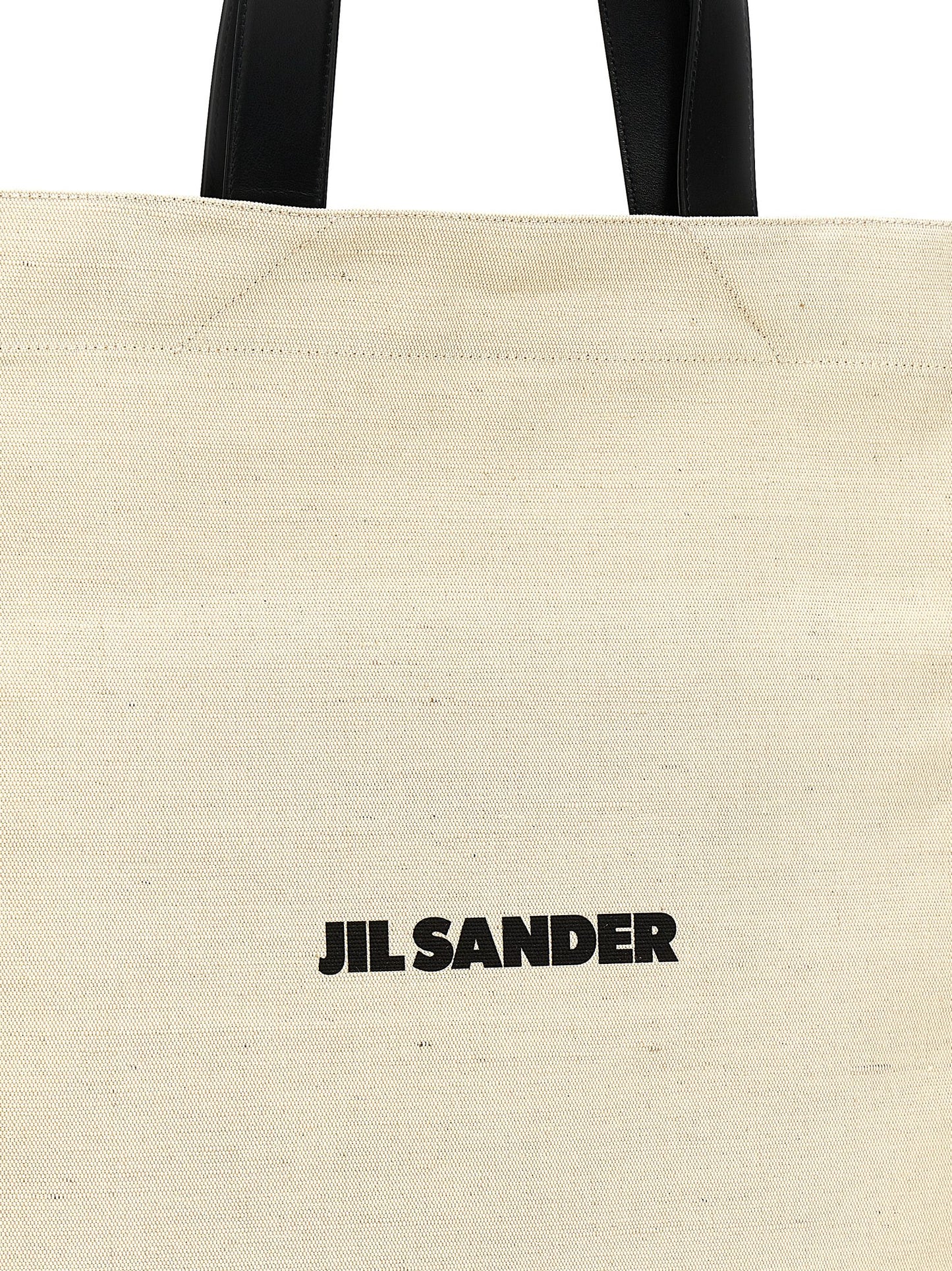 Medium Shopper Tote Bag by Jil Sander for women in cotton polyester & horn bicolour, black, white & print features an jet-set-ready silhouette, showcasing the Cotton Polyester & Horn Medium Shopper Tote Bag design with a secure , ample , and versatile handle.