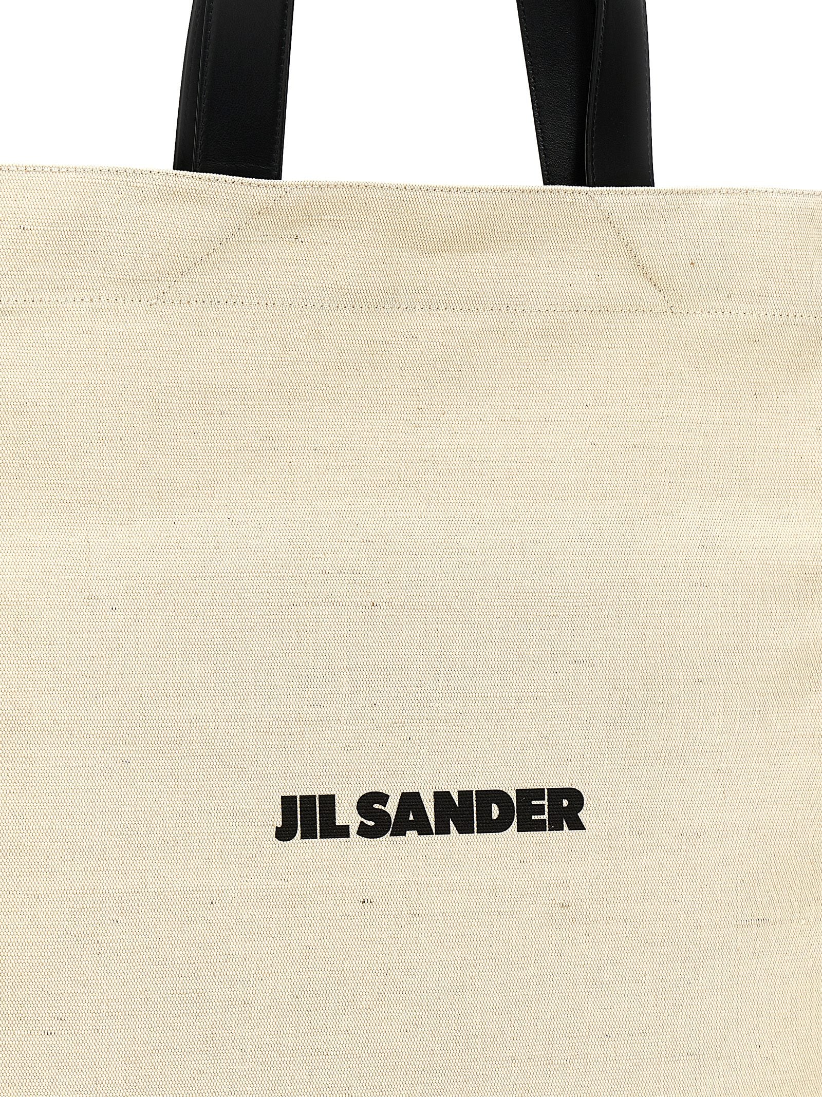 Medium Shopper Tote Bag by Jil Sander for women in cotton polyester & horn bicolour, black, white & print features an jet-set-ready silhouette, showcasing the Cotton Polyester & Horn Medium Shopper Tote Bag design with a secure , ample , and versatile handle.