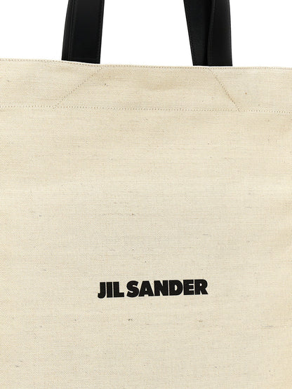 Medium Shopper Tote Bag by Jil Sander for women in cotton polyester & horn bicolour, black, white & print features an jet-set-ready silhouette, showcasing the Cotton Polyester & Horn Medium Shopper Tote Bag design with a secure , ample , and versatile handle.