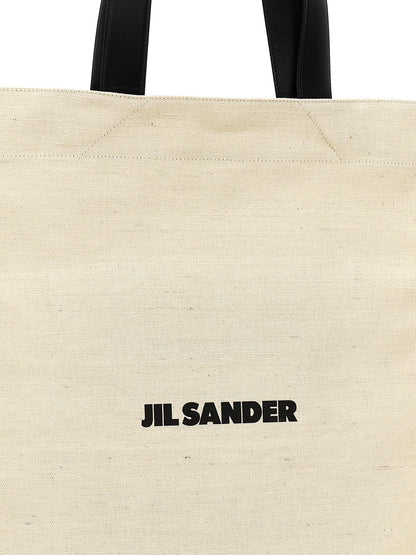 Medium Shopper Tote Bag by Jil Sander for men in leather virgin wool & nylon bicolour, black & white features an jet-set-ready silhouette, showcasing the Leather Virgin Wool & Nylon Medium Shopper Tote Bag design with a secure , ample , and versatile .