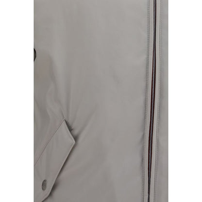Hooded Windbreaker Jacket by Brunello Cucinelli for men in polyester gray features an enduring silhouette, showcasing technical water-resistant, pockets, hooded & windproof and a sophisticated for a truly enduring aesthetic.