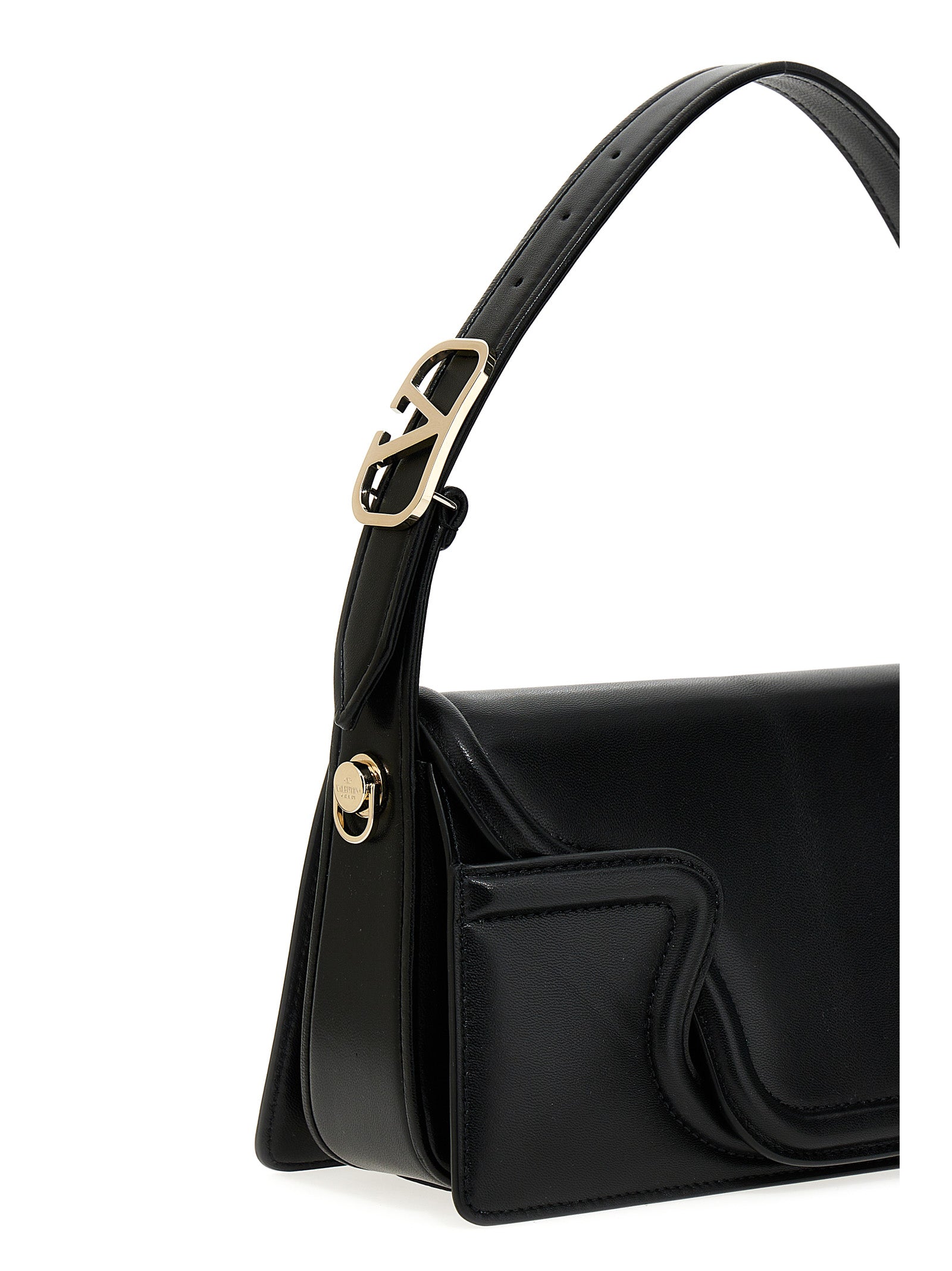 Shoulder Flap Bag by Valentino Garavani for women in leather & metal black & signature features a statuesque silhouette, showcasing a secure flap & magnetic and statuesque with versatile shoulder-strap, adjustable-strap & handle for a statuesque finish.