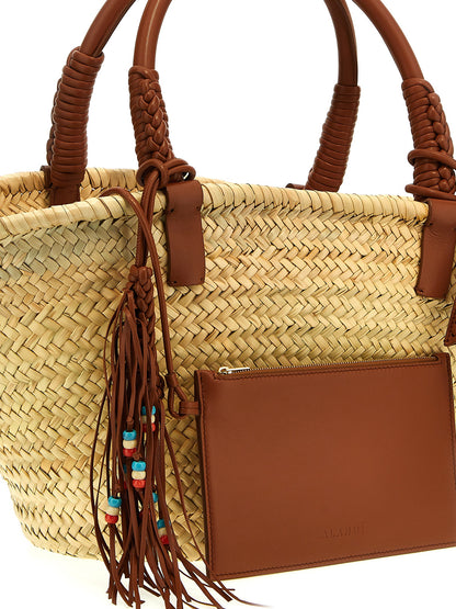 This Clutch Handbag by Alanui for women in lana wool blend and brown presents a sculptural silhouette featuring a secure , ample , and versatile handle for a sculptural finish.