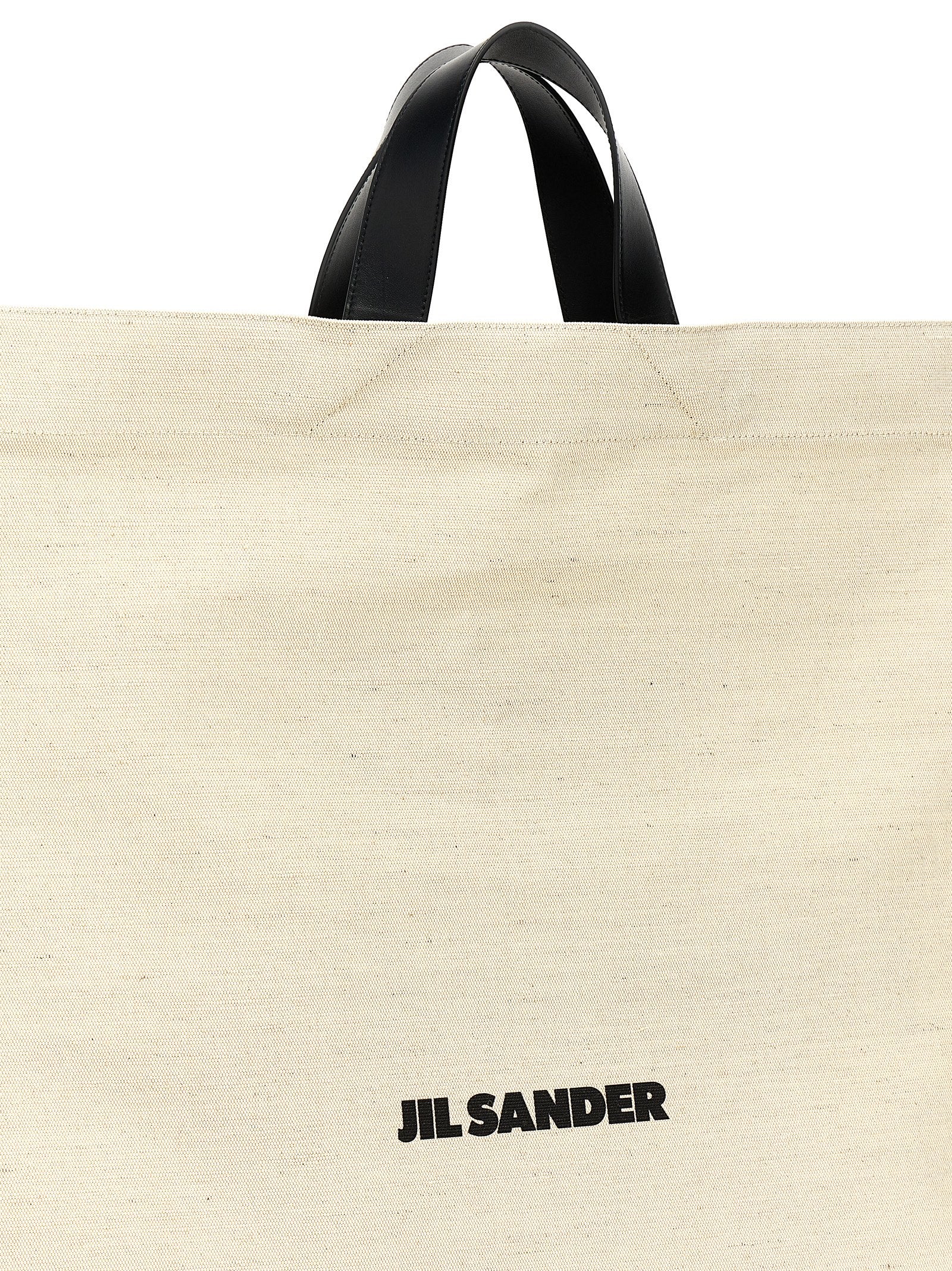 Shopper Tote Bag by Jil Sander for women in cotton polyester canvas bicolour, black, white & print features a jet-set Cotton Polyester Canvas Shopper Tote Bag design, complete with a secure , ample , and versatile handle for a jet-set look.