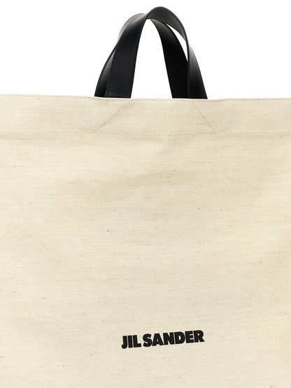 Shopper Tote Bag by Jil Sander for women in cotton polyester canvas bicolour, black, white & print features a jet-set Cotton Polyester Canvas Shopper Tote Bag design, complete with a secure , ample , and versatile handle for a jet-set look.