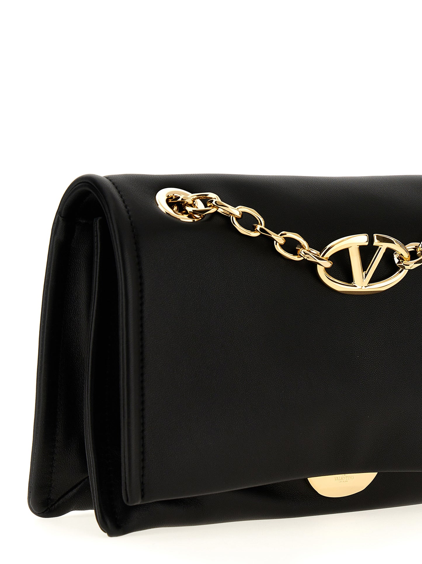 Shoulder Flap Bag by Valentino Garavani for women in lamb leather black showcases a statuesque silhouette, artfully detailed with a secure flap & magnetic, organized , and versatile shoulder-strap & handle for a statuesque look.