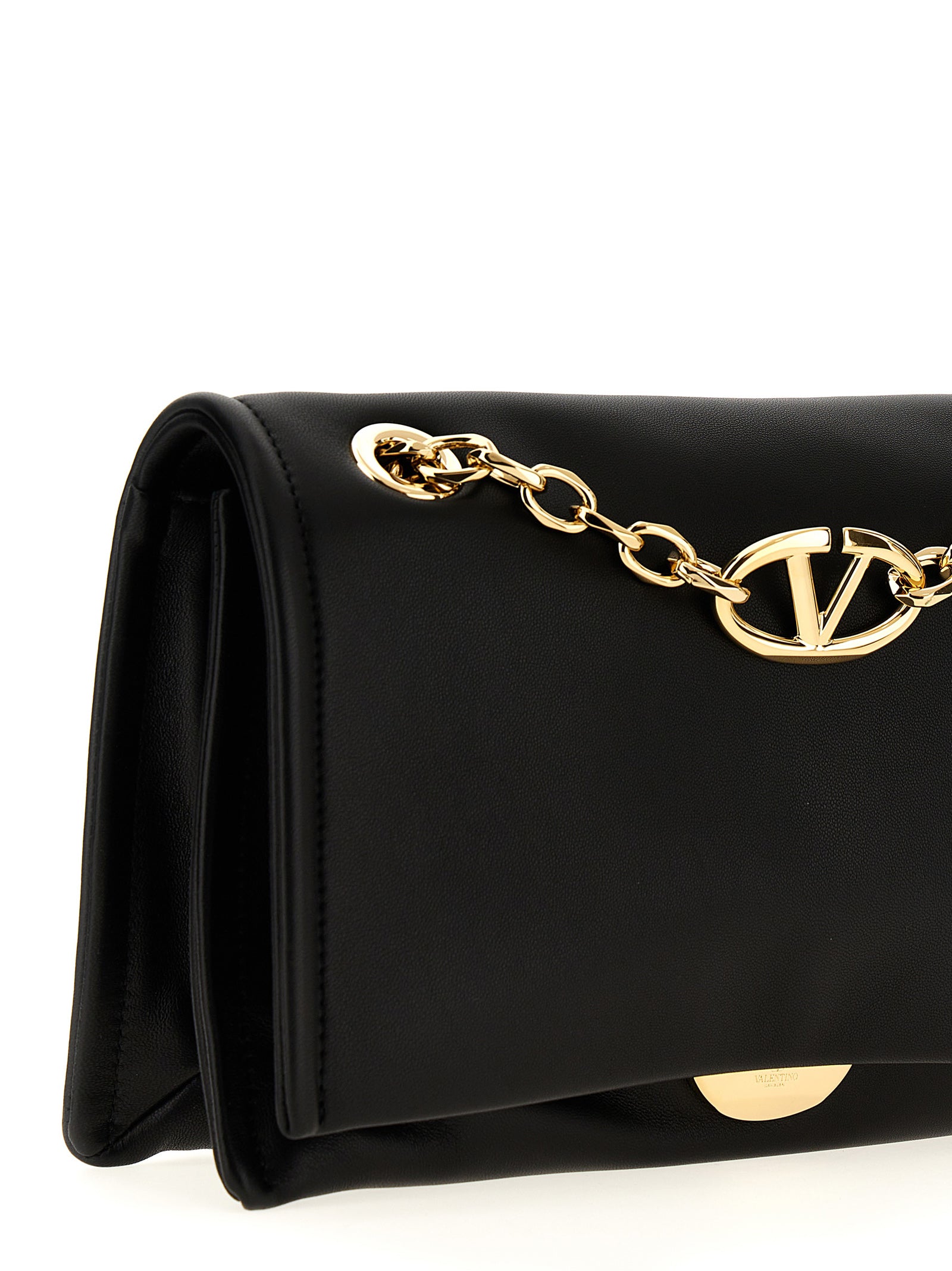 Shoulder Flap Bag by Valentino Garavani for women in lamb leather black showcases a statuesque silhouette, artfully detailed with a secure flap & magnetic, organized , and versatile shoulder-strap & handle for a statuesque look.