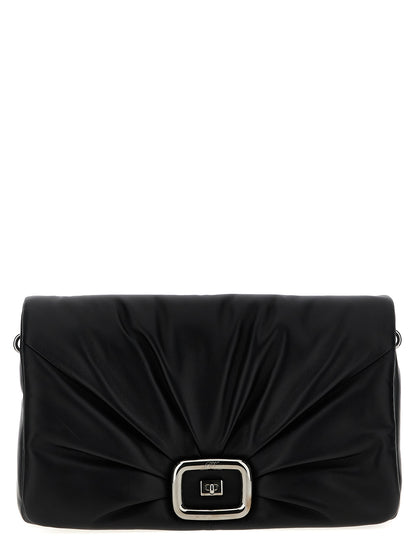 Large Shoulder Flap Bag by Roger Vivier for women in leather & metal black presents a statuesque silhouette, showcasing a secure flap, magnetic & buckle and statuesque with versatile shoulder-strap, adjustable-strap & handle for a sophisticated look.