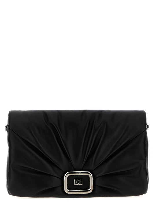 Large Shoulder Flap Bag by Roger Vivier for women in leather & metal black presents a statuesque silhouette, showcasing a secure flap, magnetic & buckle and statuesque with versatile shoulder-strap, adjustable-strap & handle for a sophisticated look.