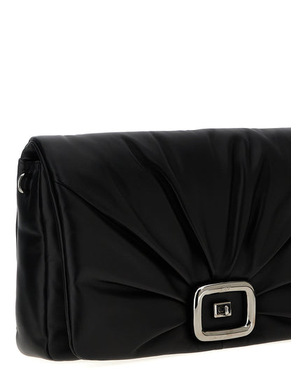 Large Shoulder Flap Bag by Roger Vivier for women in leather & metal black features a effortless chic silhouette with a secure flap, magnetic & buckle, ample , and versatile shoulder-strap, adjustable-strap & handle for a effortless chic finish.