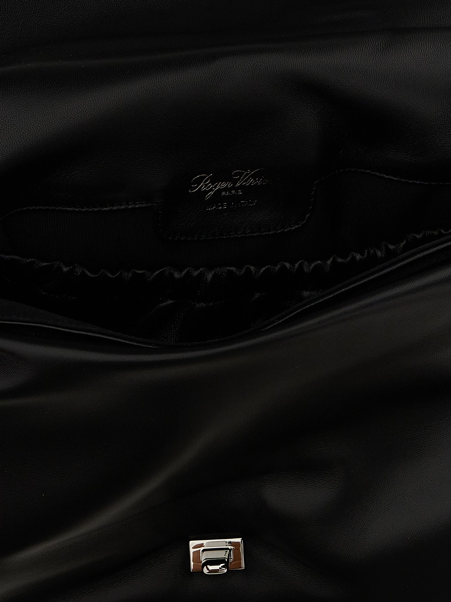 Large Shoulder Flap Bag by Roger Vivier for women in leather & metal black features an effortlessly chic silhouette with a secure flap, magnetic & buckle, ample , and versatile shoulder-strap, adjustable-strap & handle for effortlessly chic everyday luxury.