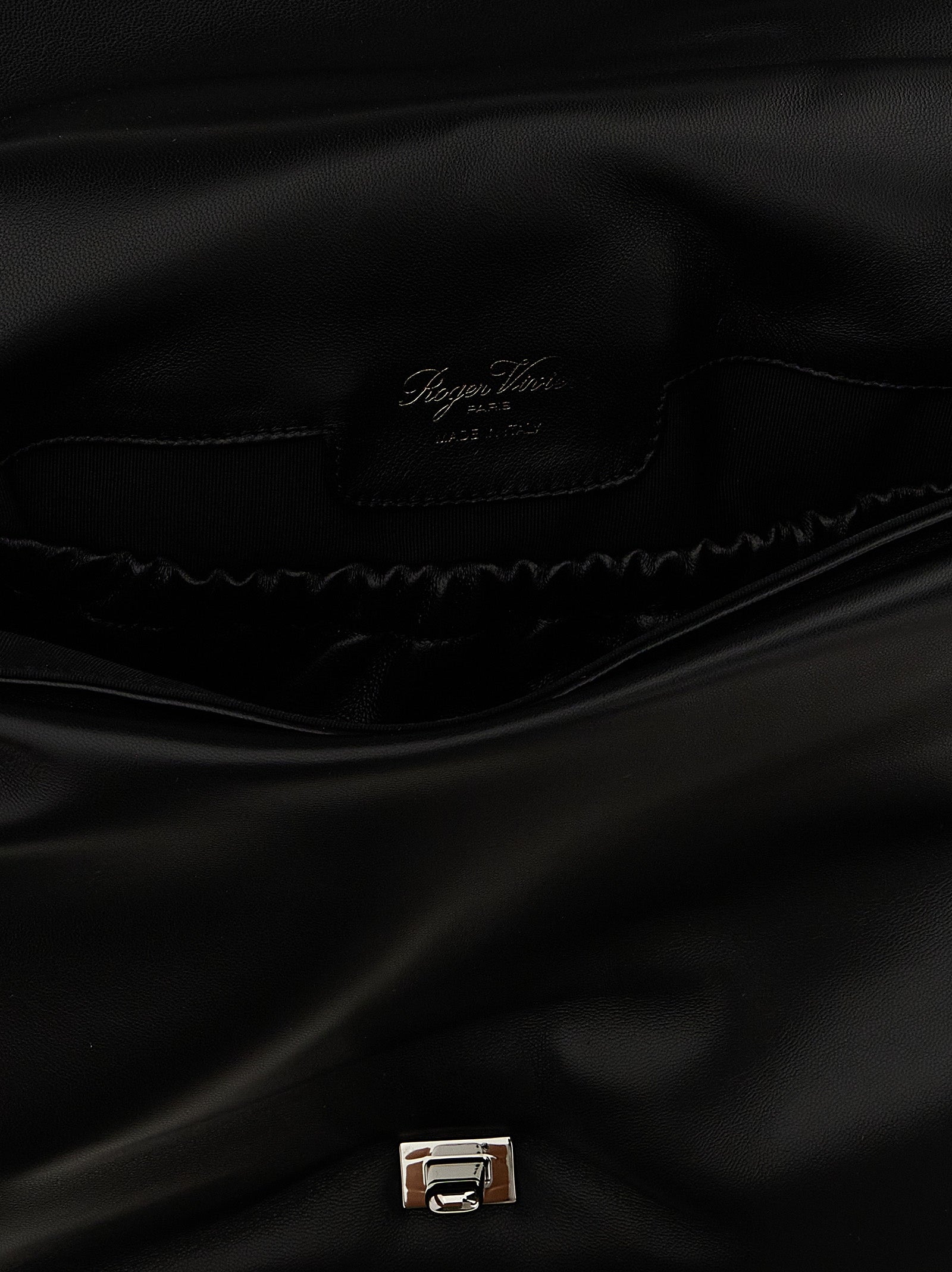Large Shoulder Flap Bag by Roger Vivier for women in leather & metal black features an effortlessly chic silhouette with a secure flap, magnetic & buckle, ample , and versatile shoulder-strap, adjustable-strap & handle for effortlessly chic everyday luxury.