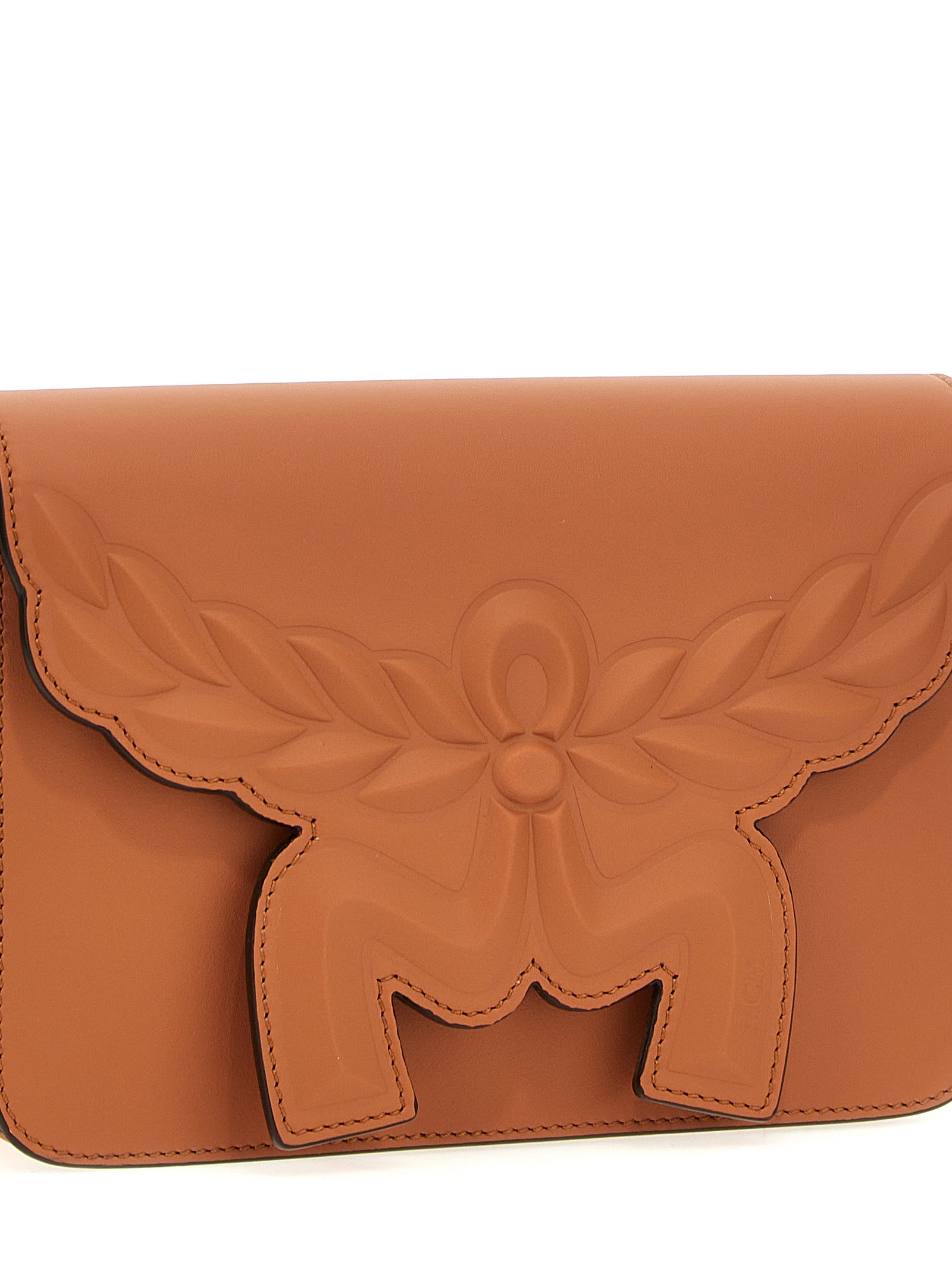 Crossbody Flap Handbag by MCM for women in calfskin leather brown features a transformative sophistication silhouette, showcasing a secure flap & magnetic, ample , and versatile crossbody-strap, shoulder-strap & adjustable-strap for a transformative sophistication look.
