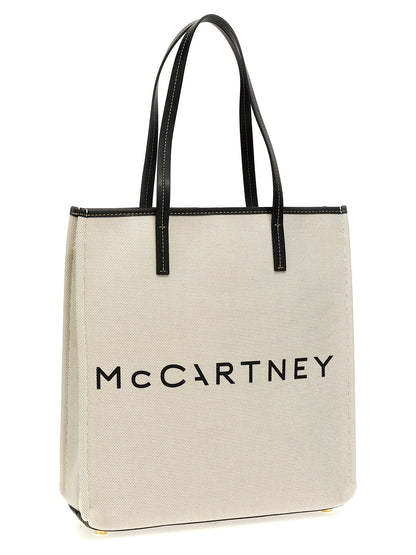 Shopper Tote Bag by Stella McCartney for women in stretch cotton modal canvas beige & print features an jet-set-ready silhouette, showcasing the Stretch Cotton Modal Canvas Shopper Tote Bag design with a secure , ample , and versatile handle.